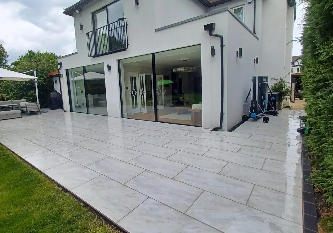 Large tiled back garden patio